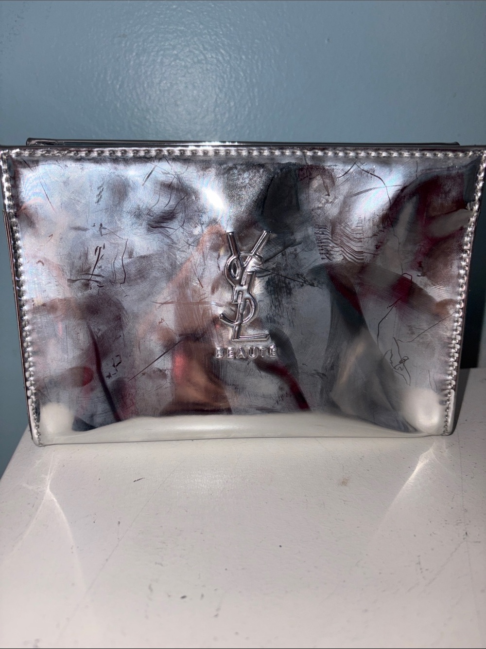 Yves Saint Laurent Silver Metallic Leather Toiletry Pouch with Embossed YSL